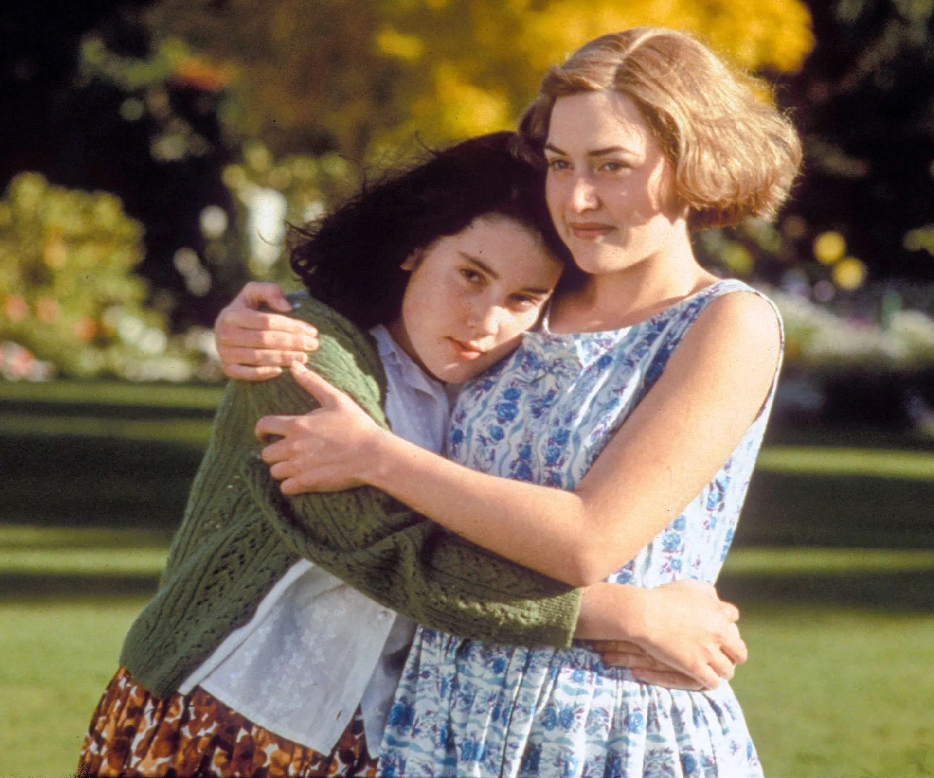 A young Melanie Lynskey hugging Kate Winslet in Heavenly Creatures