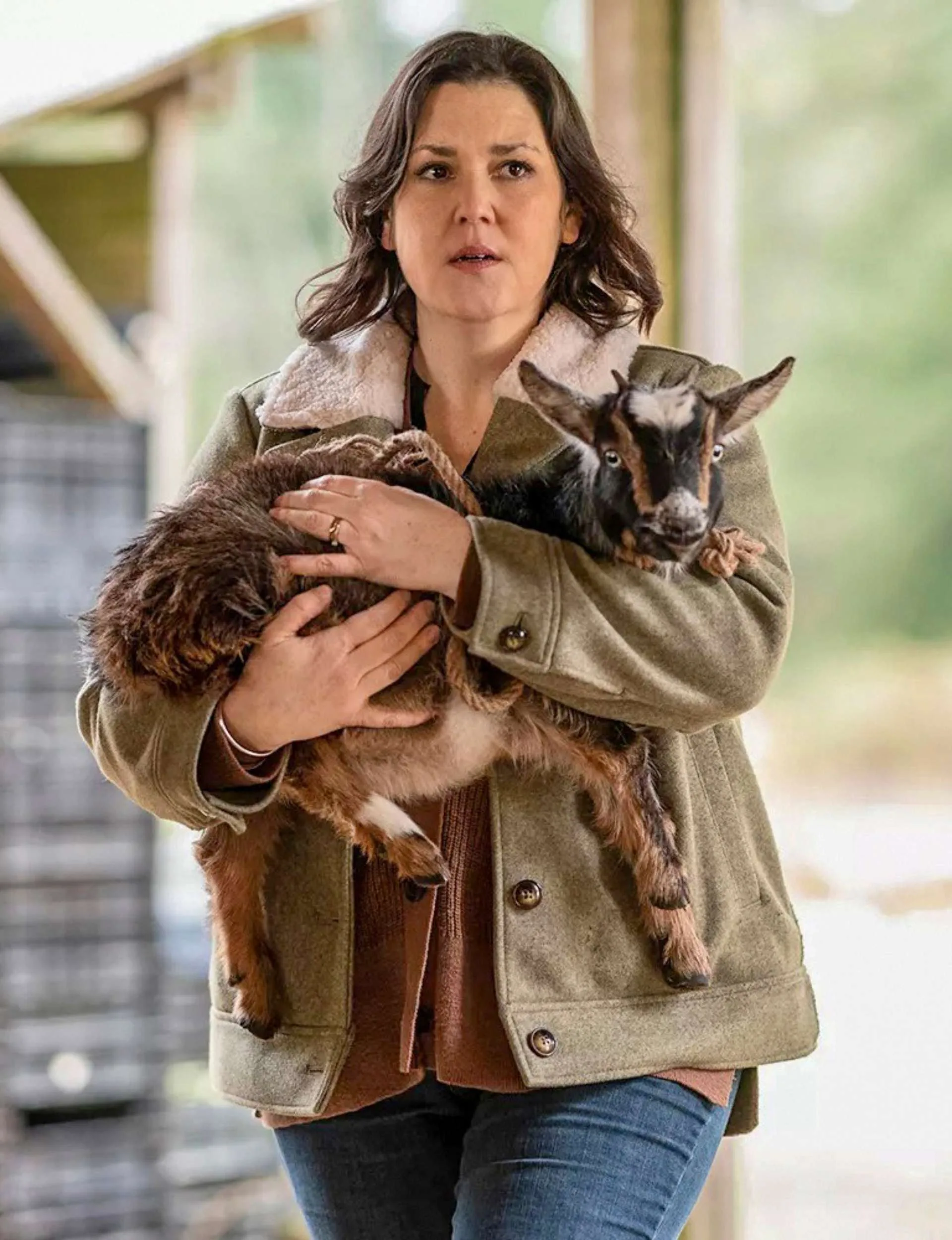 Melanie holding a goat on set of Yellowjackets