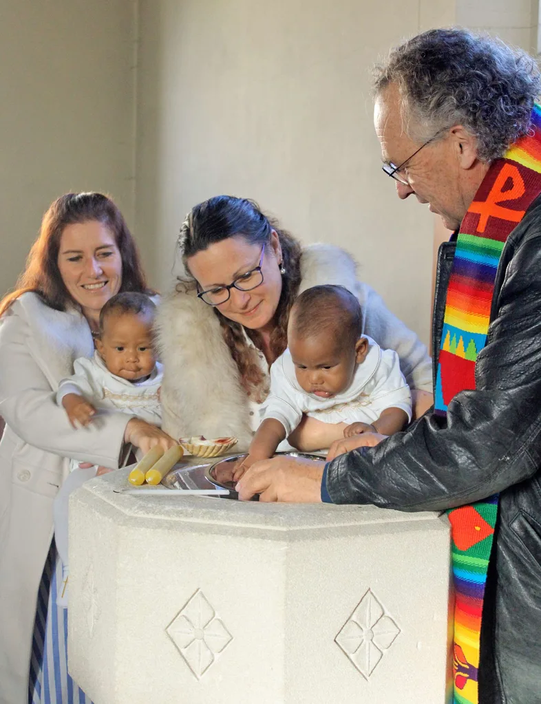 Christening the boys in a bowl of water