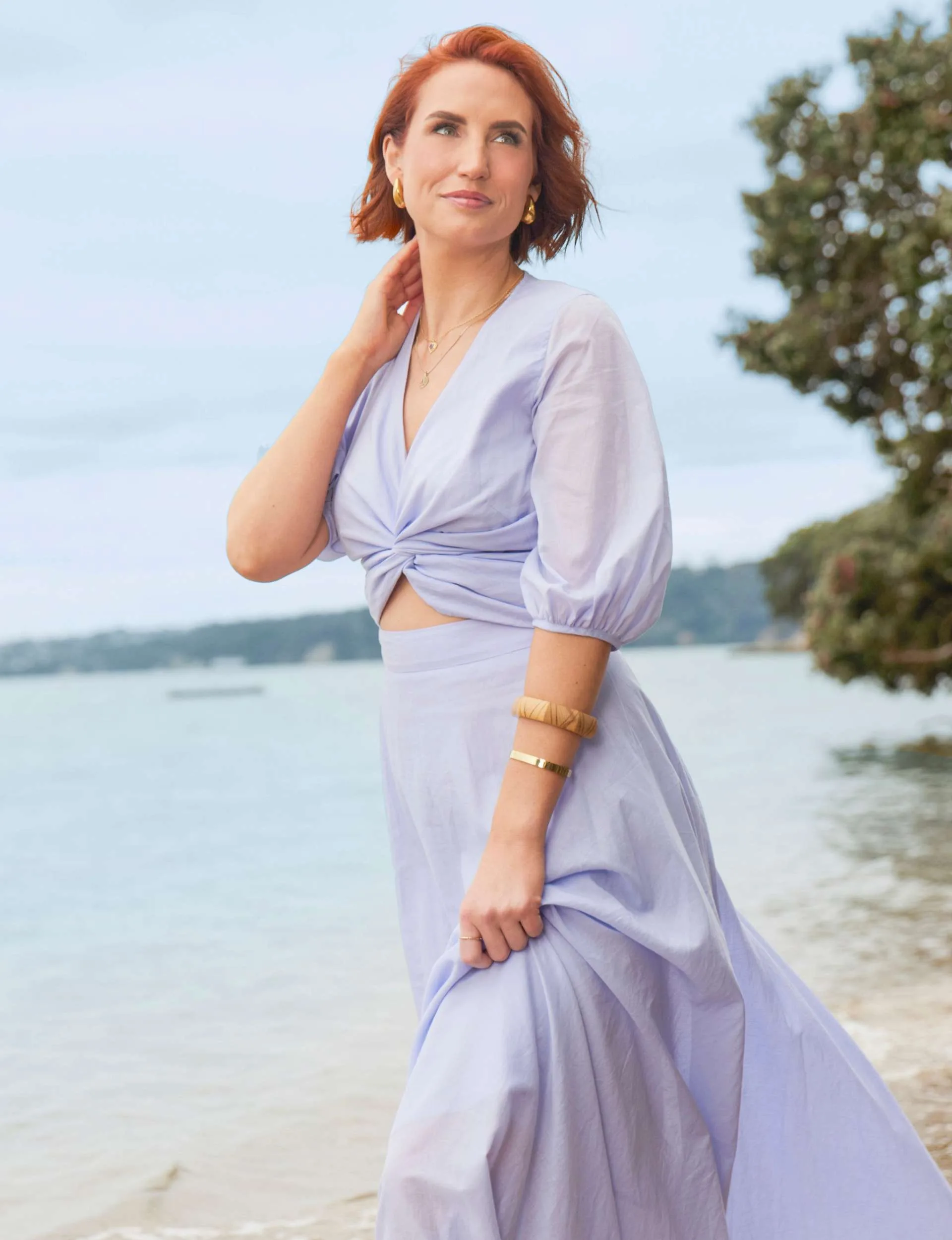 Sam Hayes staring into the distance on a beach