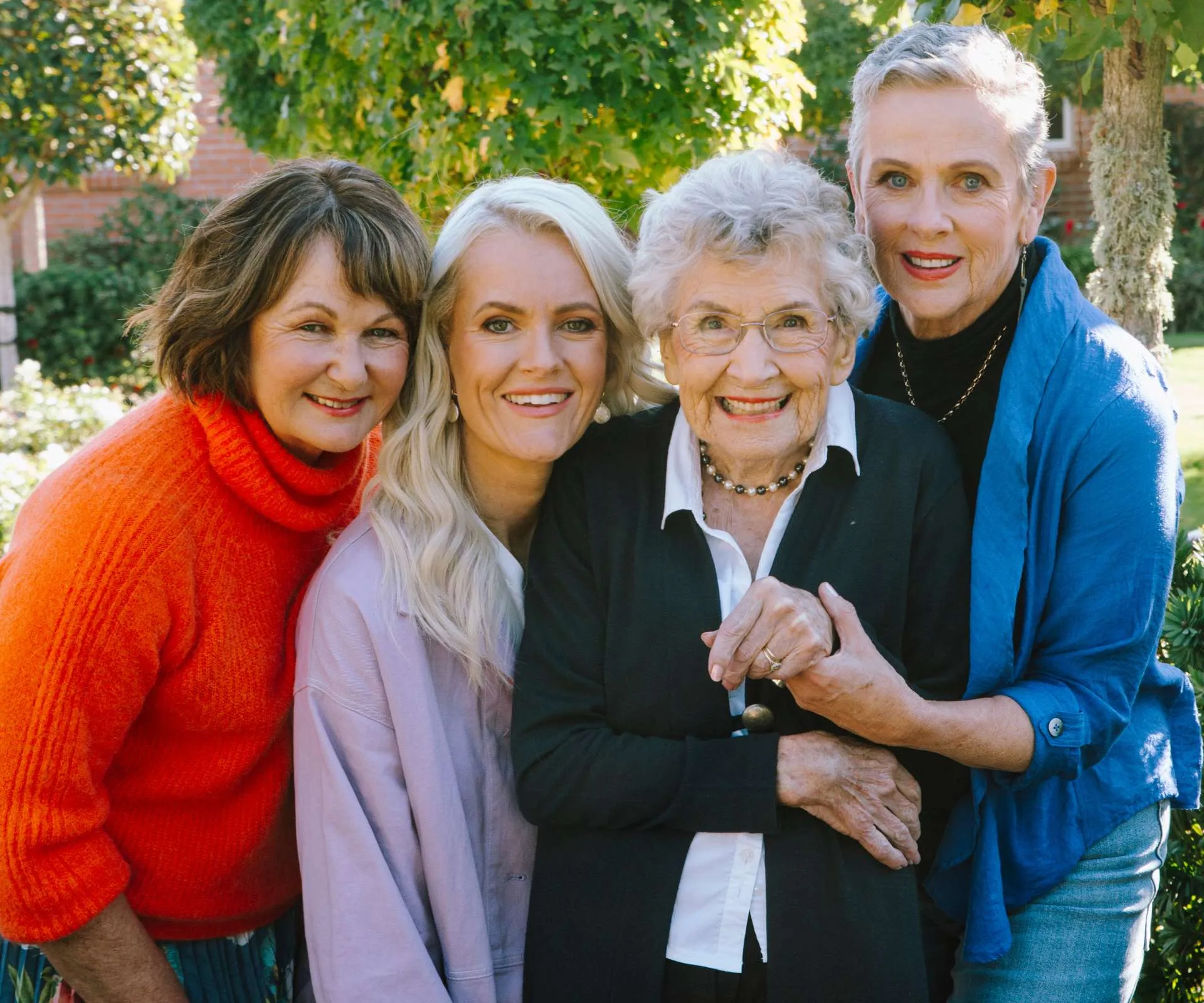 May surrounded by her daughters and granddaughter Heidi.