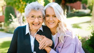 Heidi and May showing their matching rings
