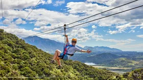 A person ziplining over the town of Kaikōura