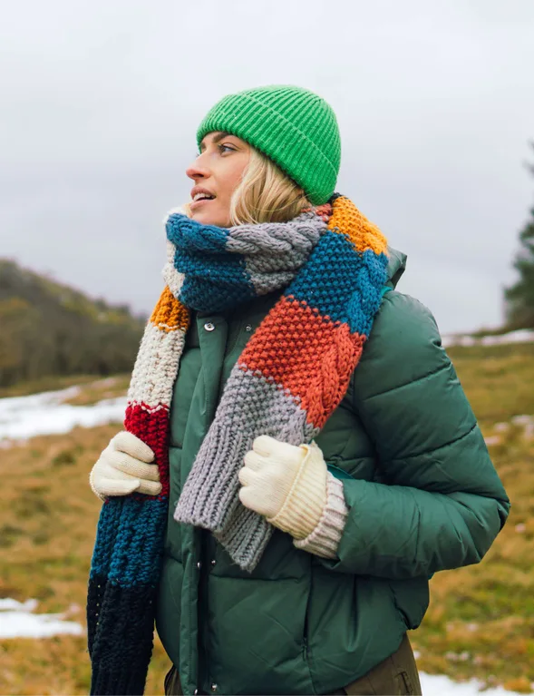 Woman in a puffer jacket with a colorful scarf