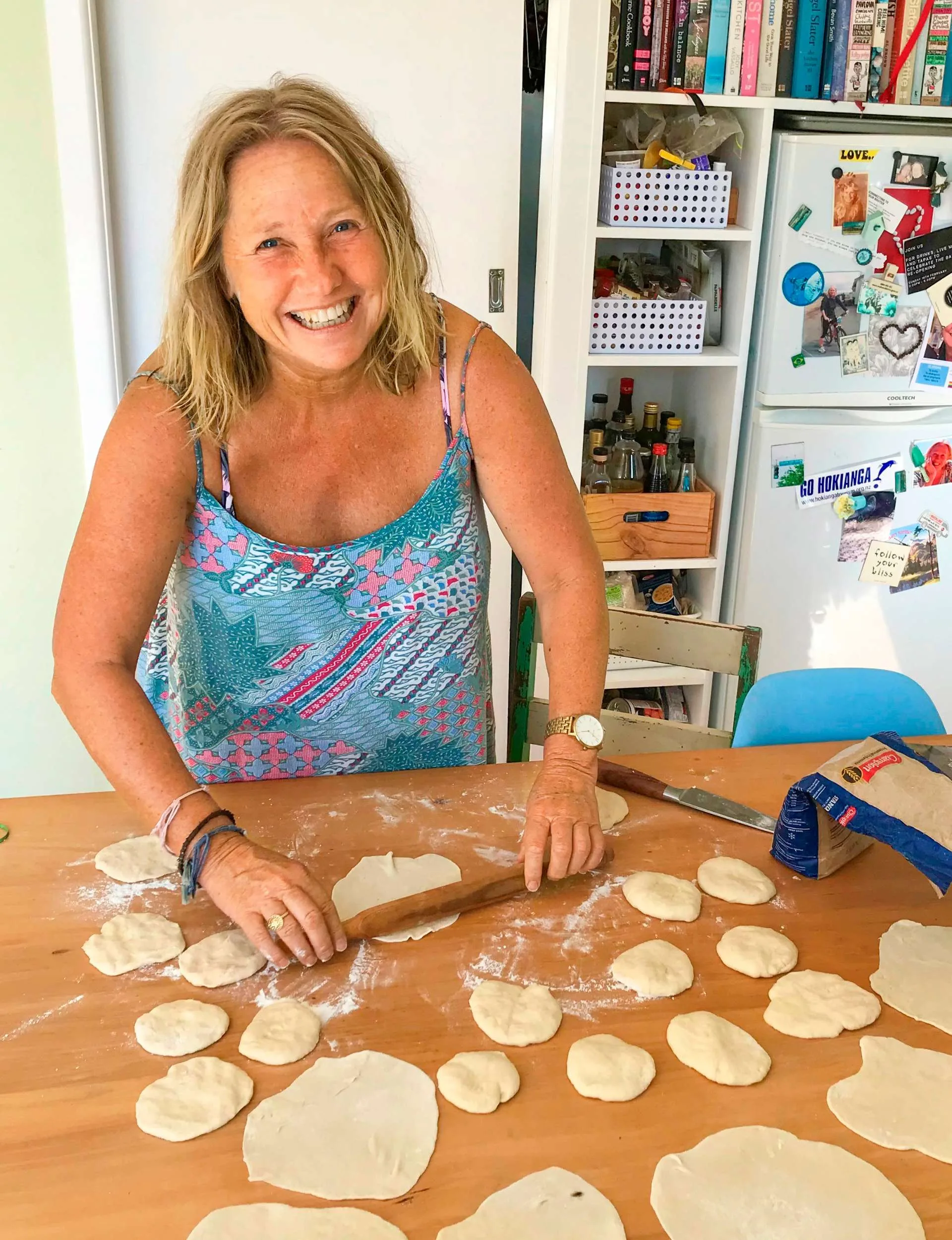 Nici Wickes rolling dough on a kitchen bench