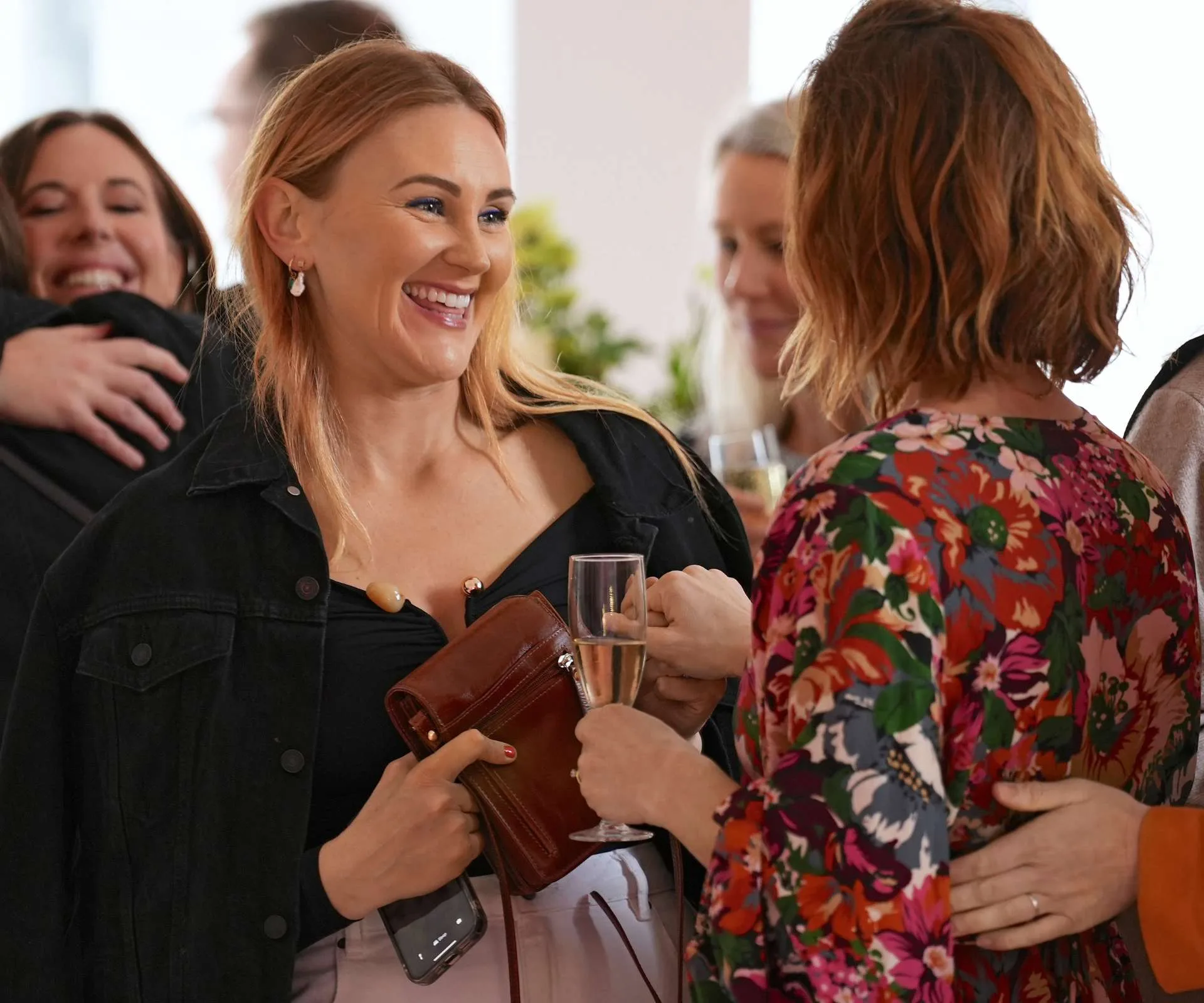 Ria Vandervis chatting to bestie Amelia Reid-Meredith with a champagne flute in hand