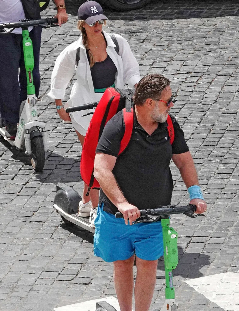 Russell Crowe and new wife Britney riding electric scooters around Rome