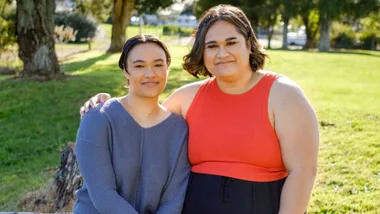 Ashleigh and Dariah standing together in a park
