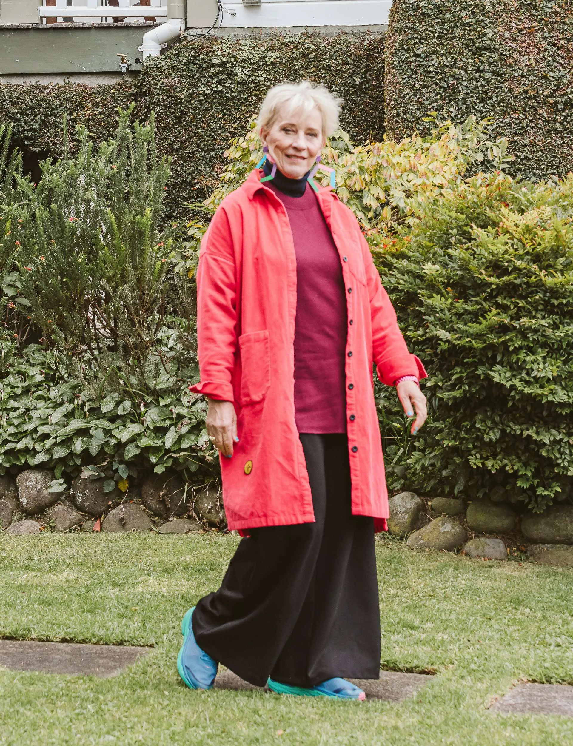 Helen Brown walking through her garden