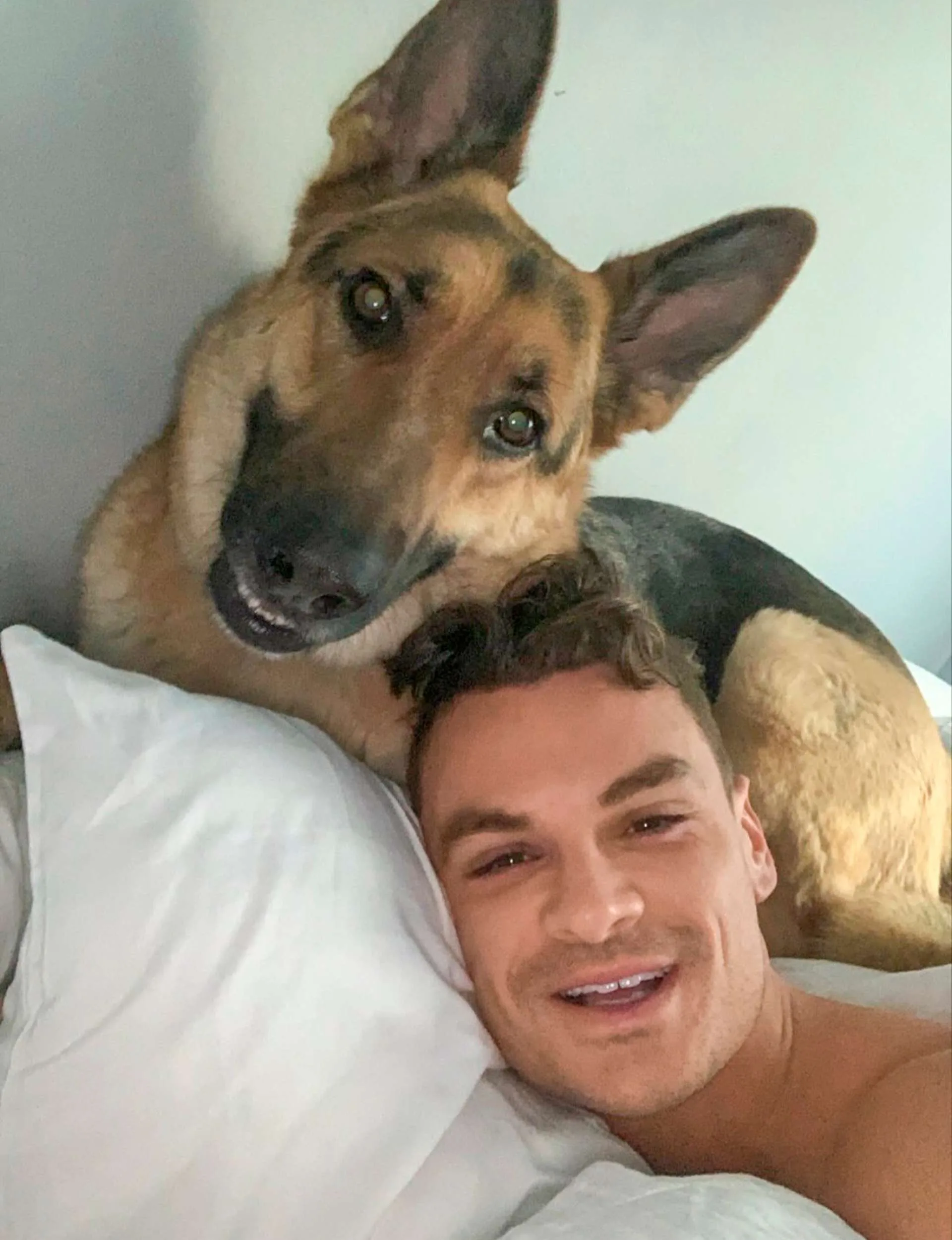 Jules taking a selfie in bed with dog Blitz