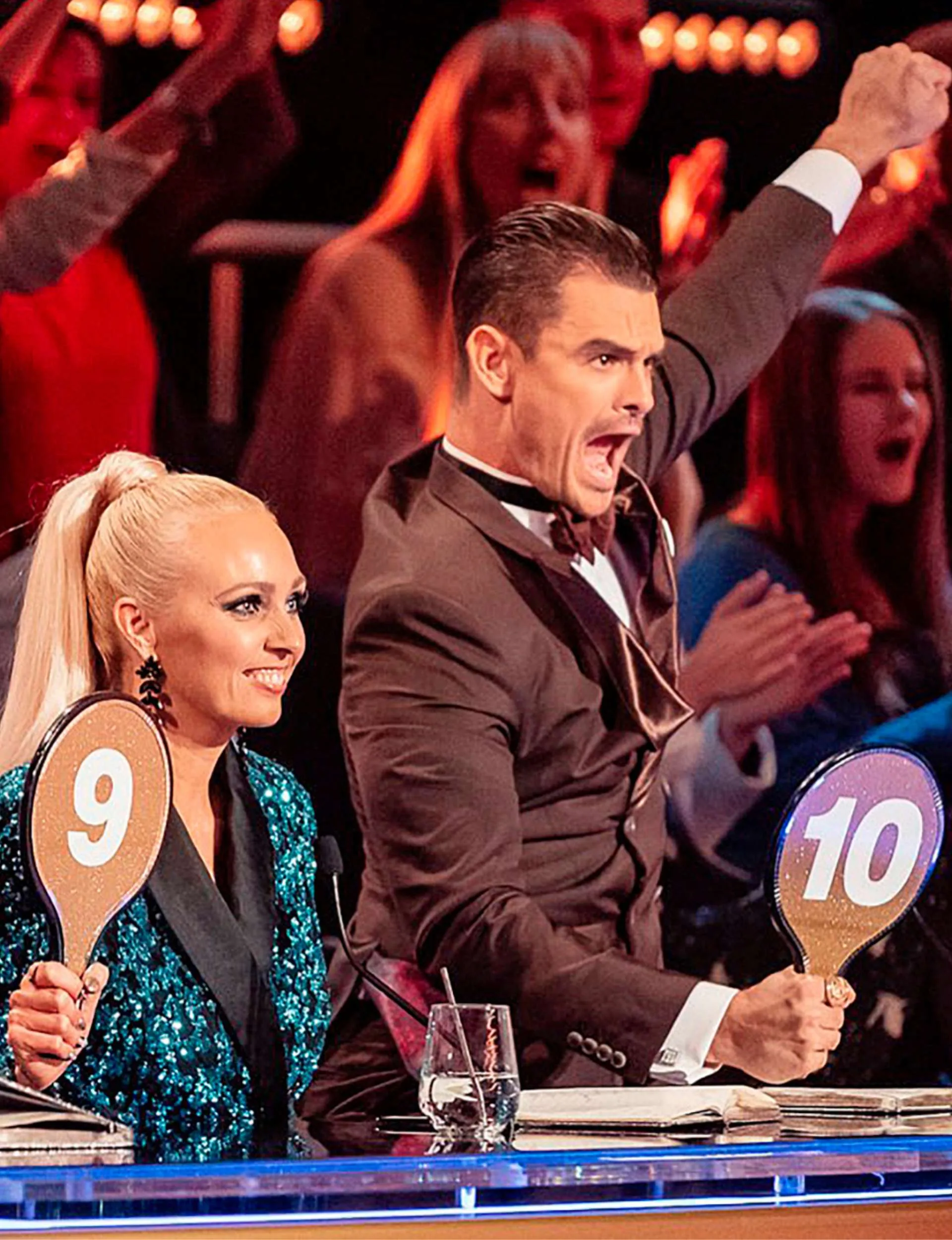 Julz Tocker celebrating on the Dancing With The Stars judging panel with fellow judge Camilla Sacre-Dallerup