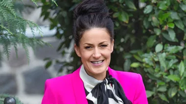 Rosie Hay in a bright pink blazer