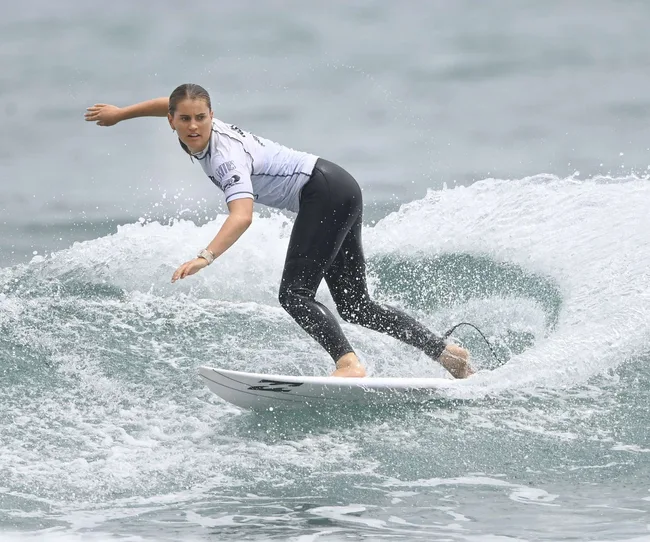 Action shot of 2024 Olympian Saffi Vette surfing