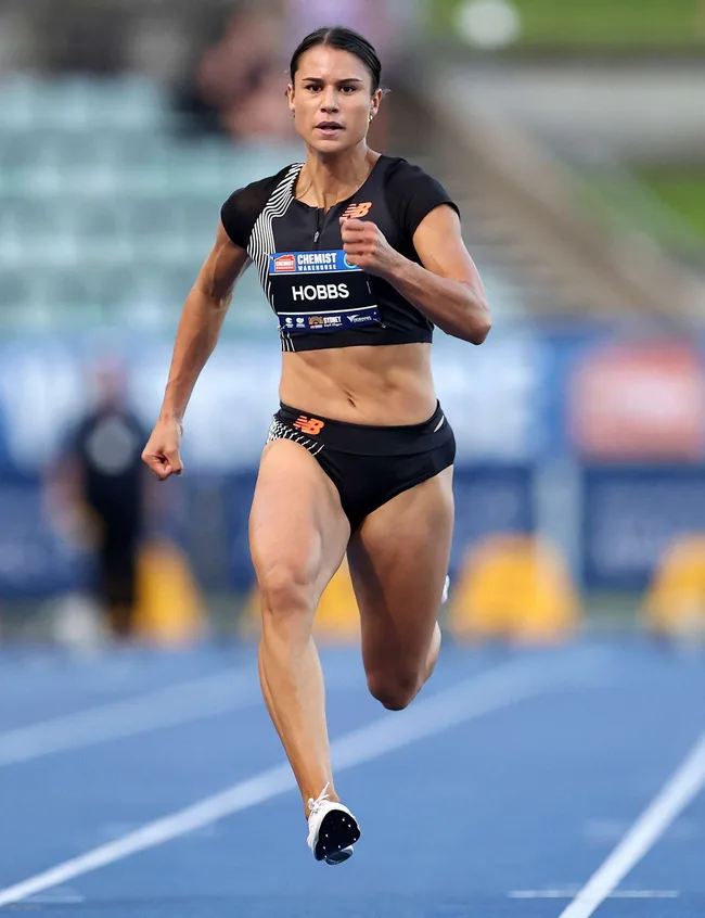 Action shot of one of the 2024 Olympians, Zoe Hobbs running