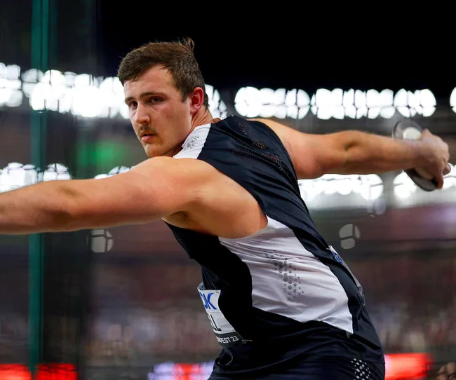 Action shop of one of the 2024 Olympians, Connor Bell throwing a discus