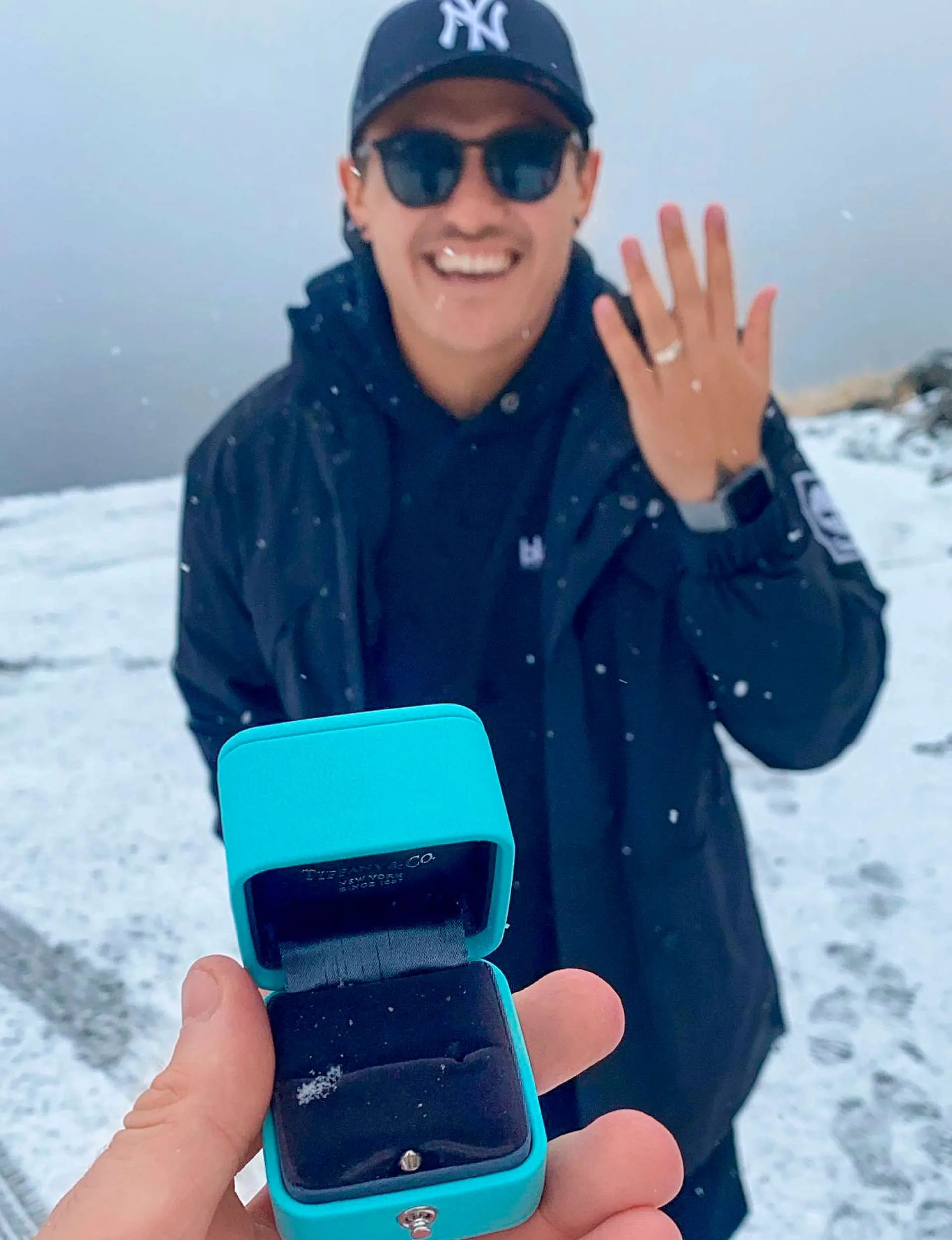 Alex after Benjamin Blackwell proposed on the top of a snowy mountain