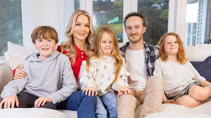 Traitors star Brittany and her family on a couch