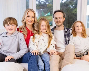 Traitors star Brittany and her family on a couch