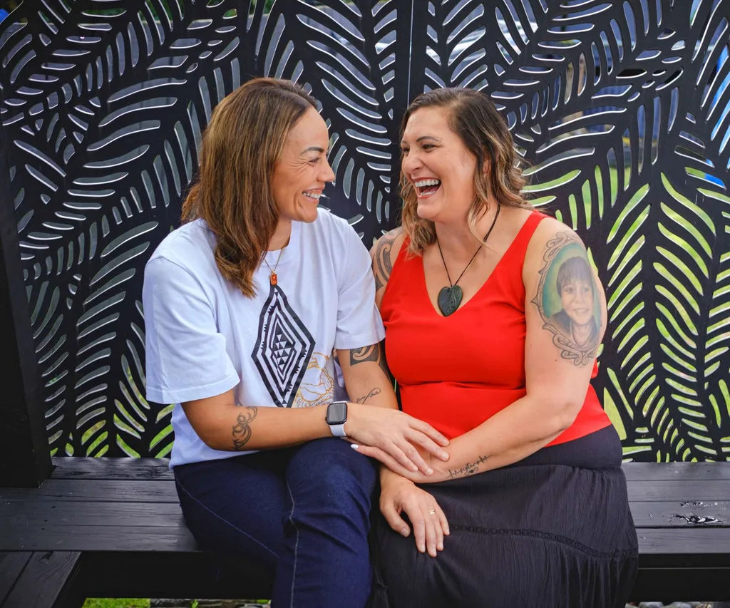 Sitting on a bench together having a laugh