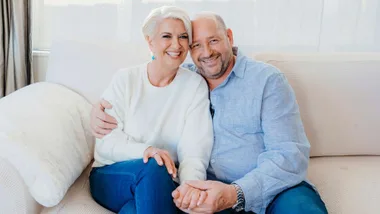 Lorna Riley and partner Mike on a couch