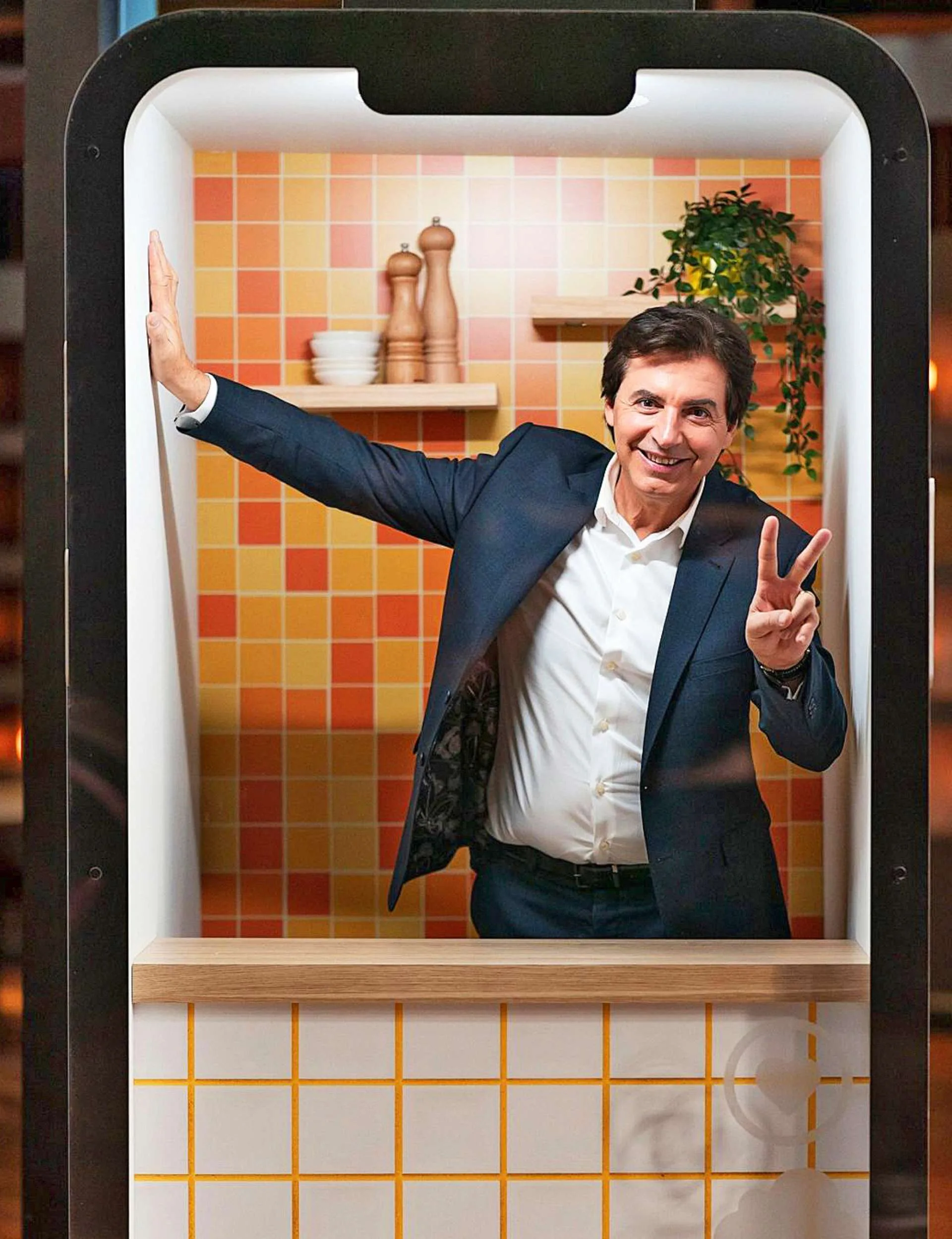 MasterChef judge Jean-Christophe Novelli posing with a peace sign