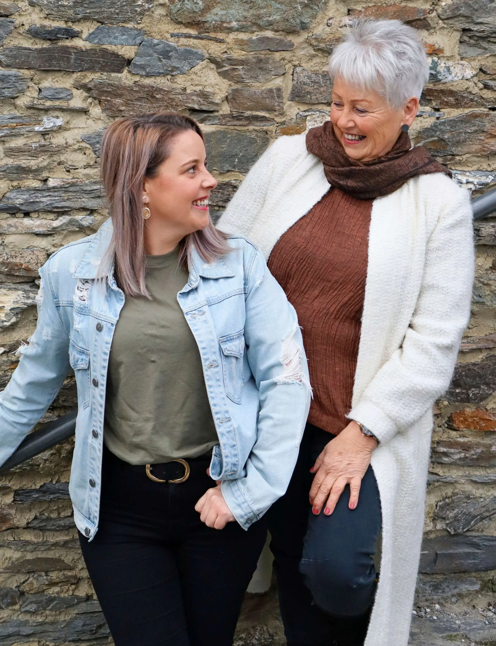 Whitney looking up the stairs at her mum