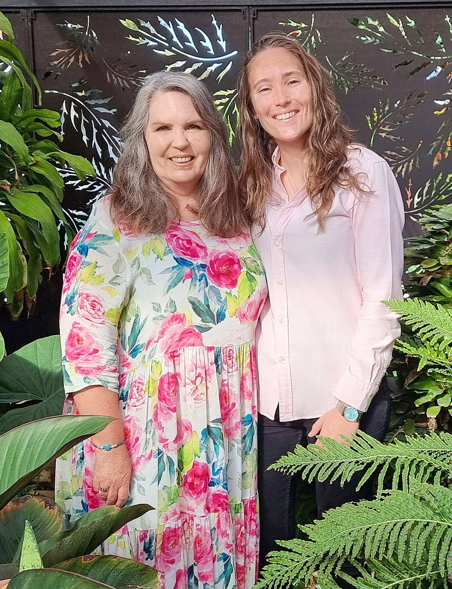 Mum and sister Liv standing in bushes