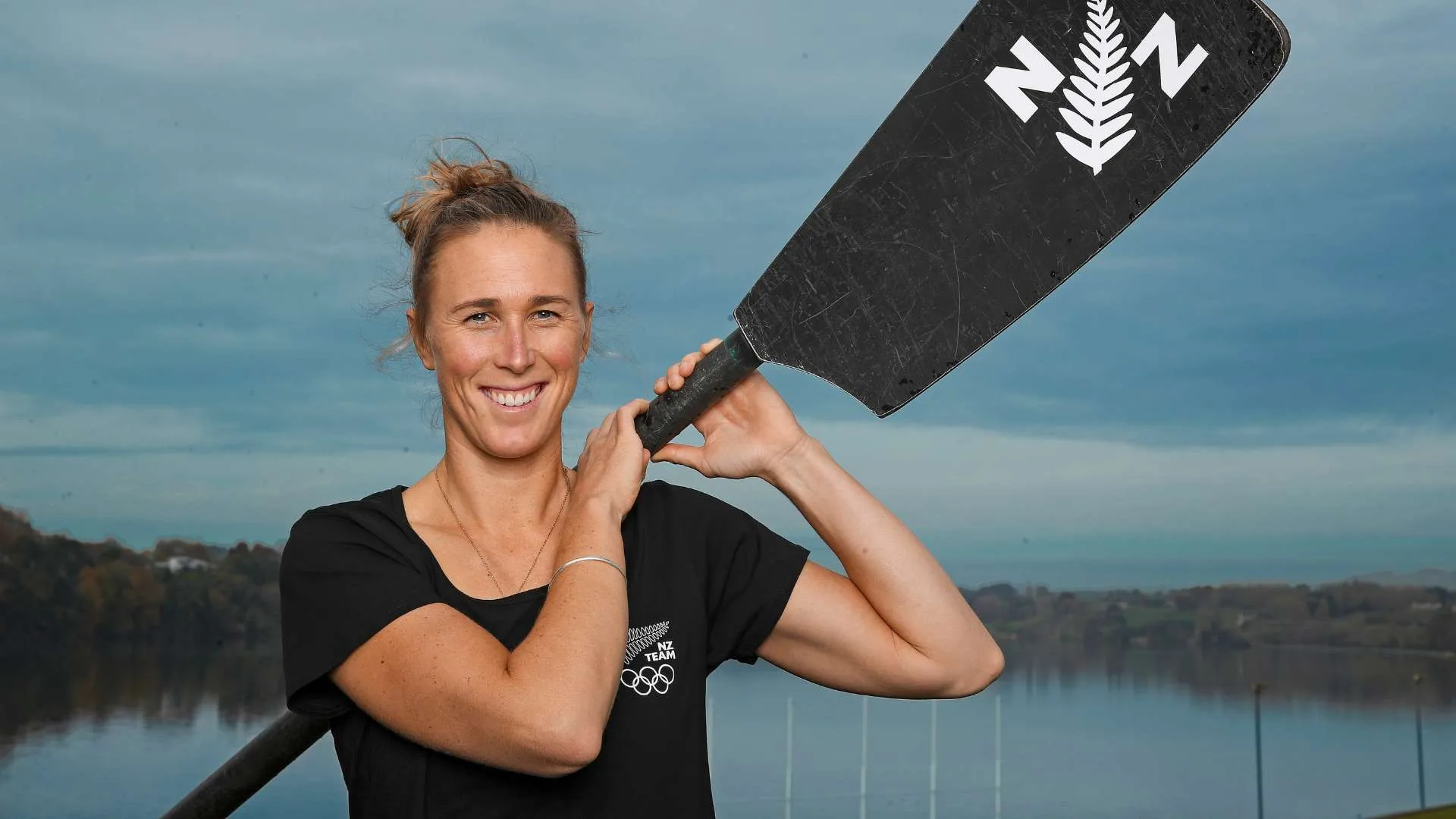 Emma Twigg holding an oar over her shoulder before the Olympics