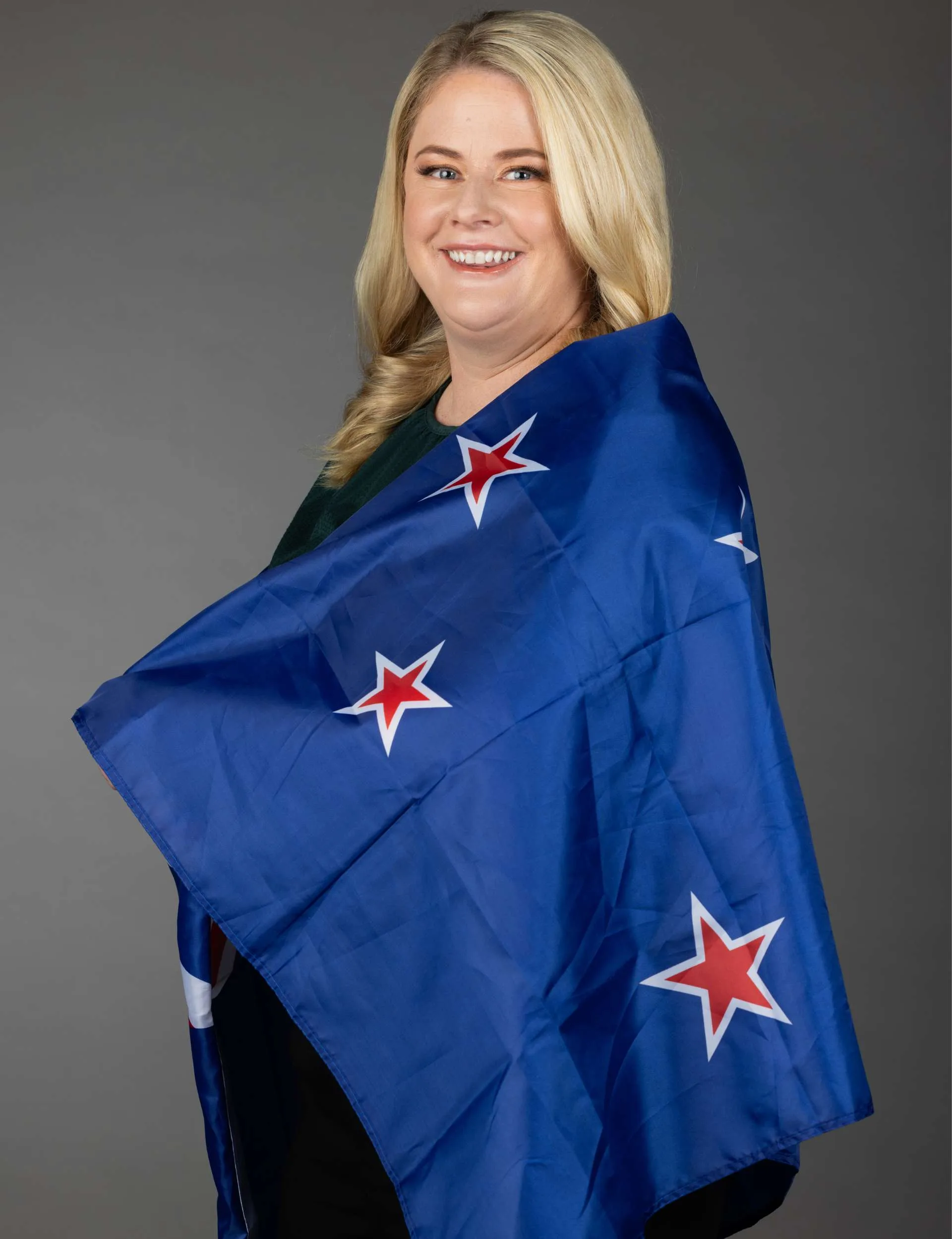 Rikki Swannell wrapped in an NZ flag
