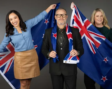 The four 2024 Sky Sport Olympics presenters, each holding NZ flags