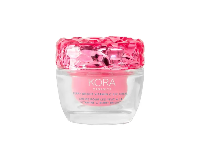 Kora Organics Berry Bright Vitamin C Eye Cream in a clear jar with a faceted pink cap.