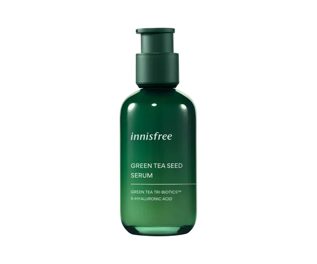 Innisfree Green Tea Seed Serum bottle with pump, labeled with ingredients: Green Tea Tri-Biotics™ and 5-Hyaluronic Acid.