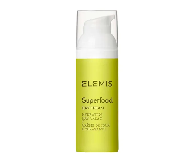 Alt text: "Green bottle of Elemis Superfood Day Cream with white pump top."