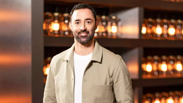 MasterChef judge Andy Allen standing in the kitchen