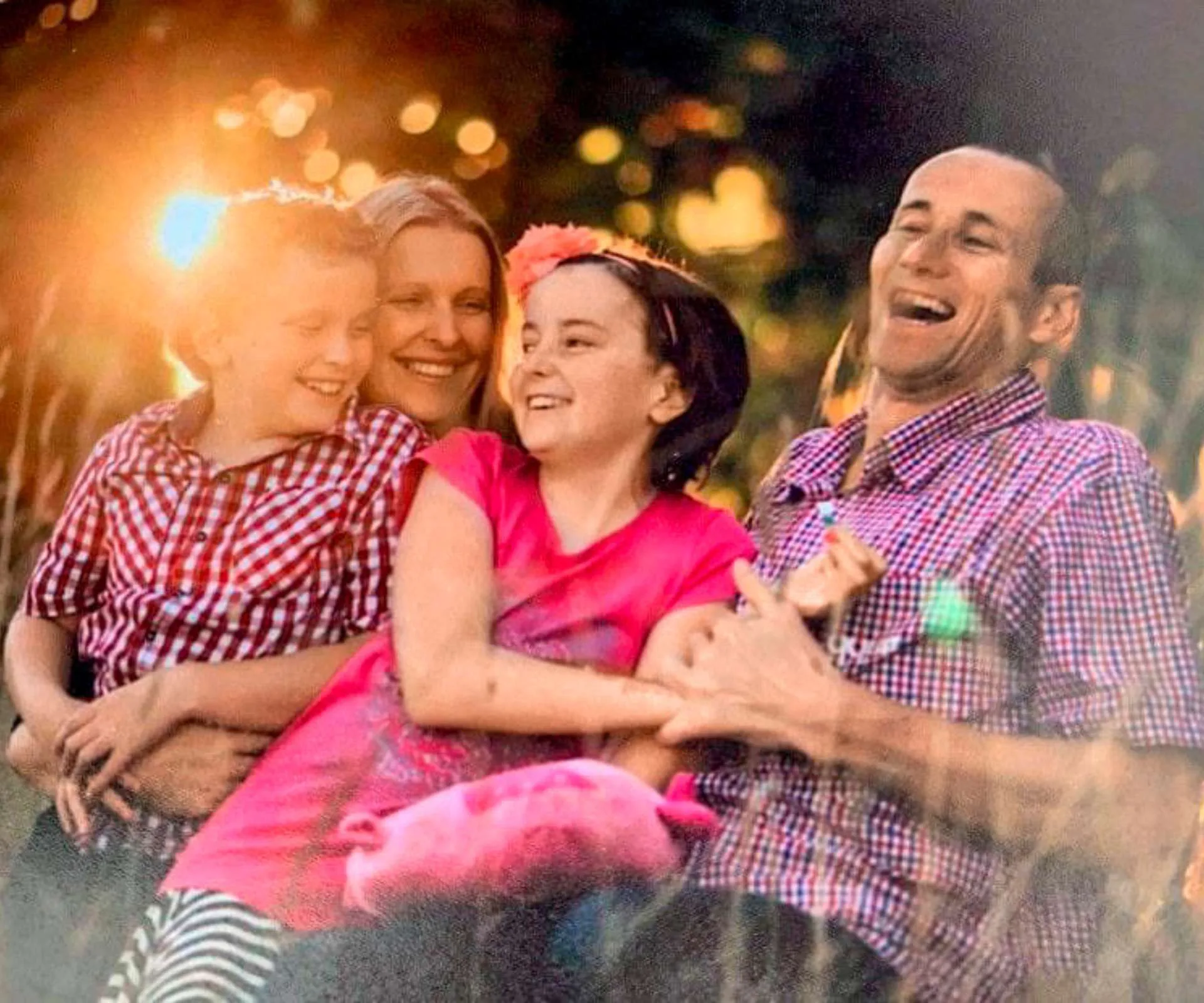 Gabby Devine with her family before she passed