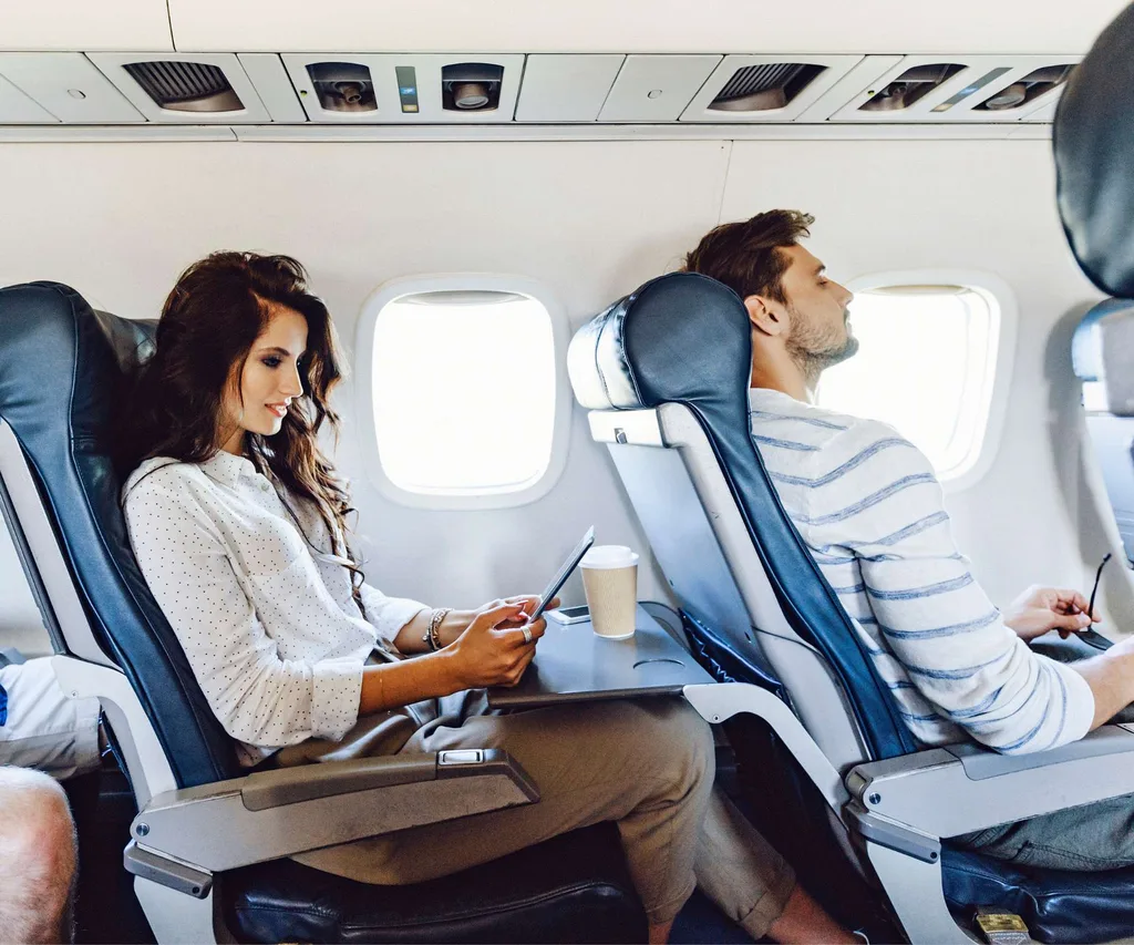 Two people flying economy