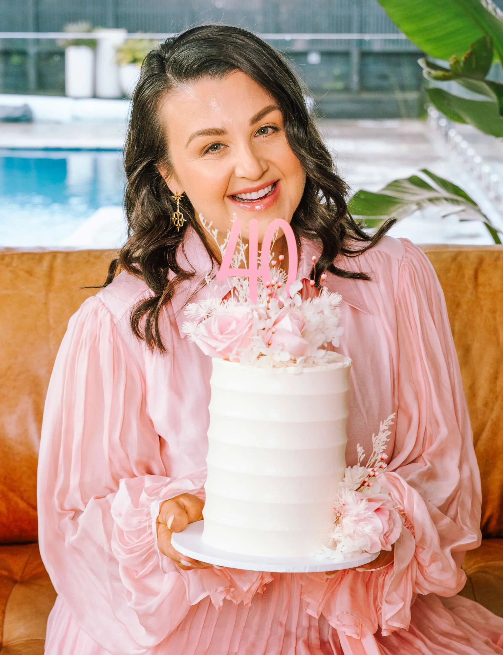 Megan Papas smiling with her 40th birthday cake