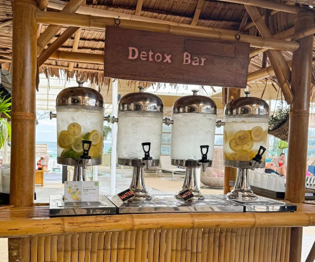 A bamboo bar with big chilled taps of water and lemon and lime infused water