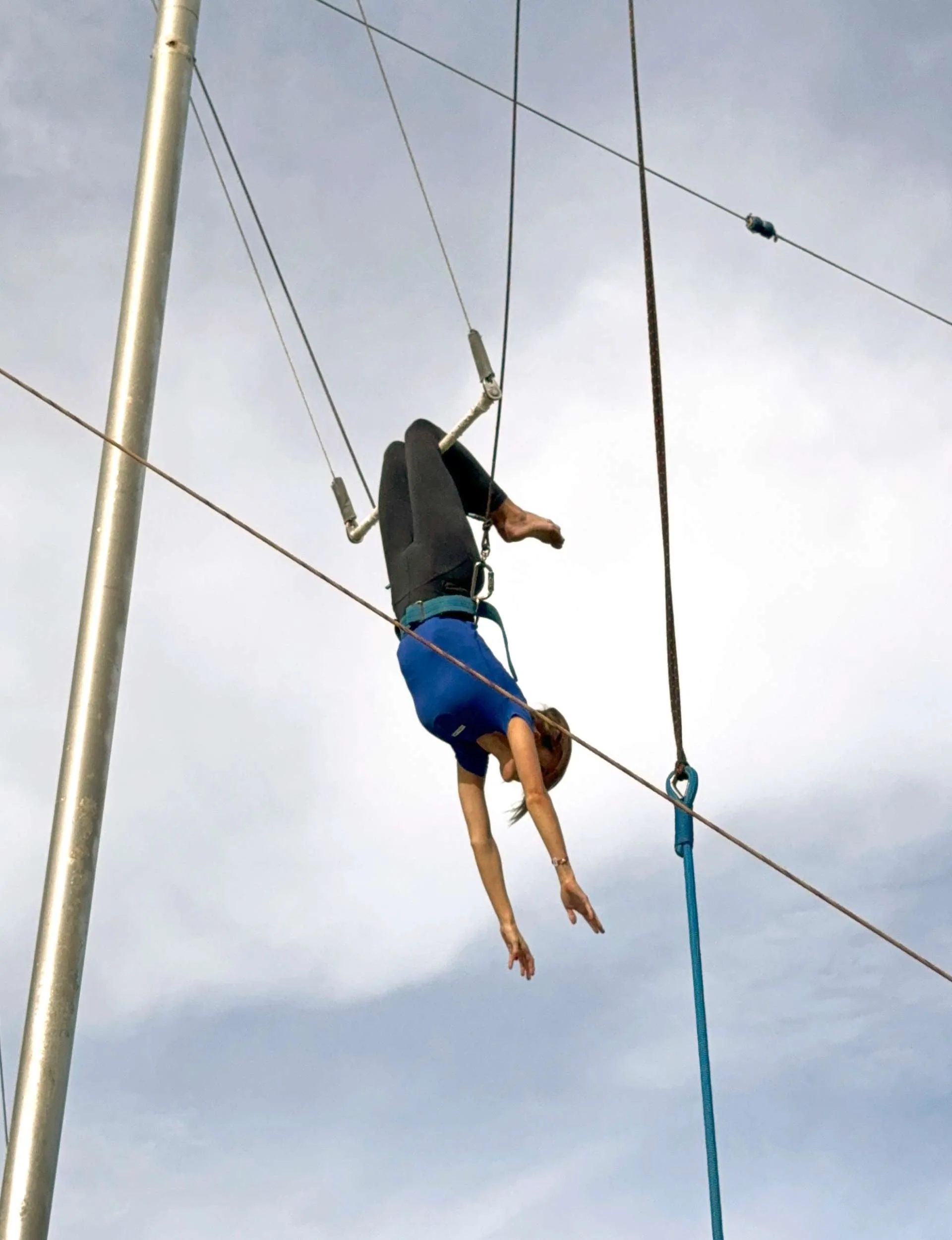Anna Lee swinging from a trapeze at Club Med Phuket