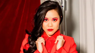 Dawn Cheong in a red coat with red eyeshadow