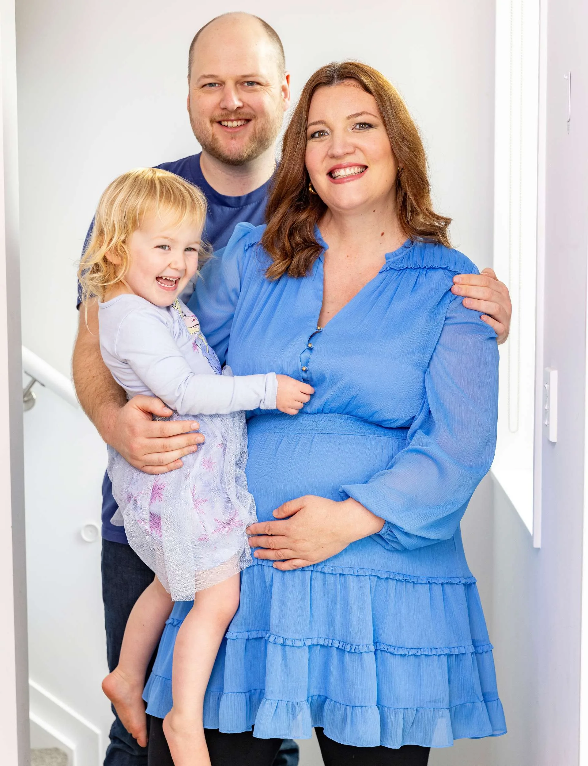 Don’t Lick That writer Lana with fiancé Jules and daughter Sophie, cradling her baby bump