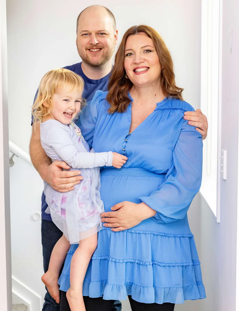 Don’t Lick That writer Lana with fiancé Jules and daughter Sophie, cradling her baby bump