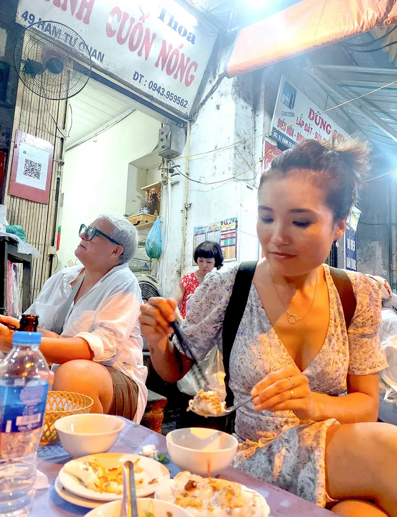 Jenny Suo eating while on holiday in Hanoi