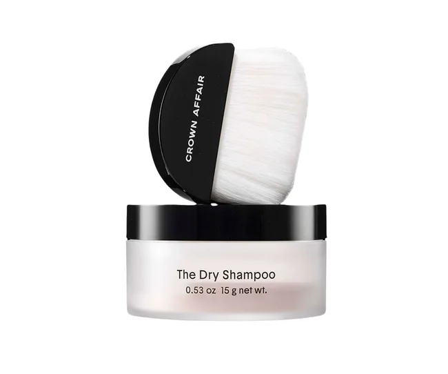 Crown Affair dry shampoo with a white brush on a black lid container.