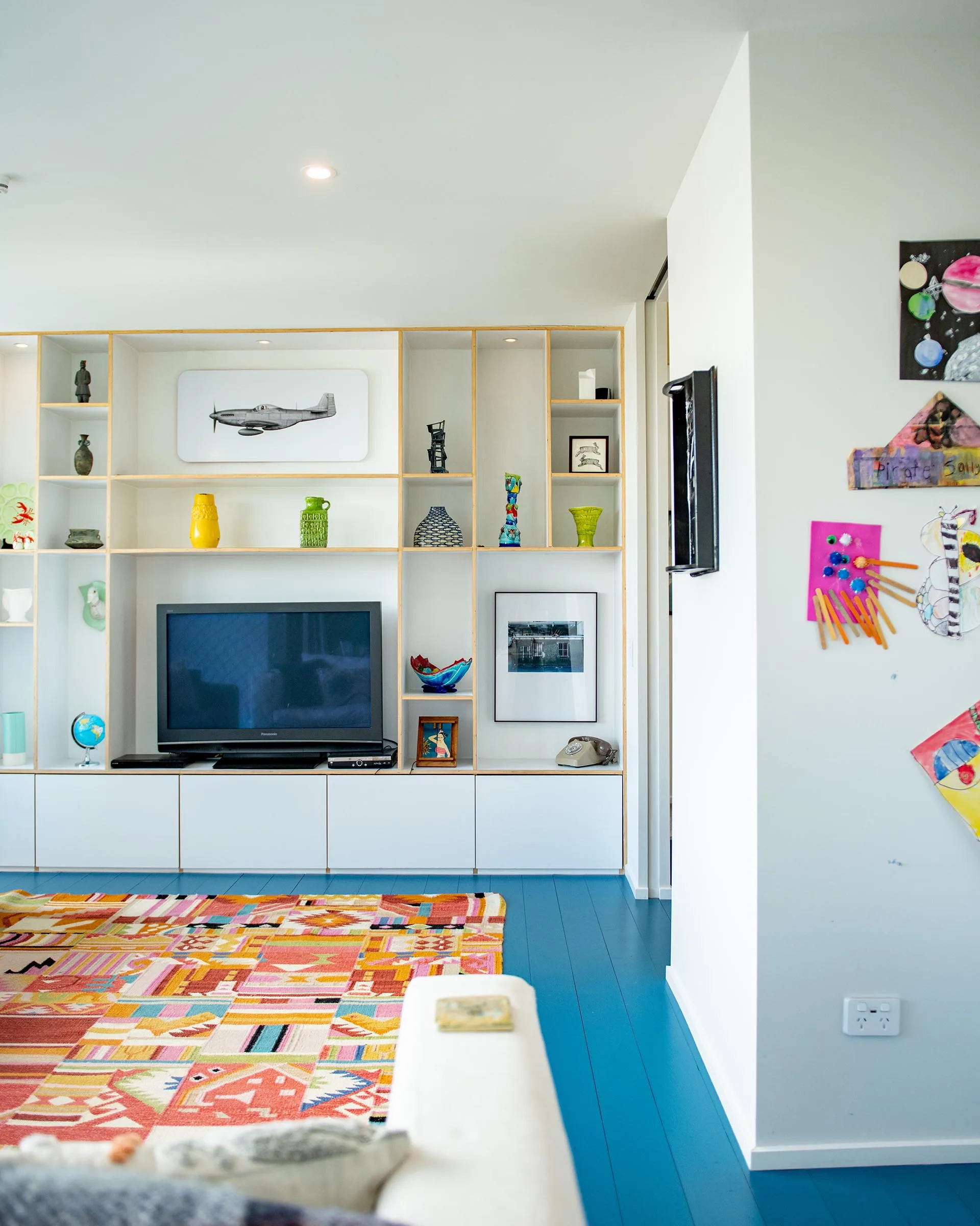 The living room of the 2024 Resene Colour Home Award winning home with the floorboards painted in Resene Spinnaker