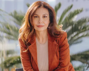 caroline laurinet wearing burnt orange suit