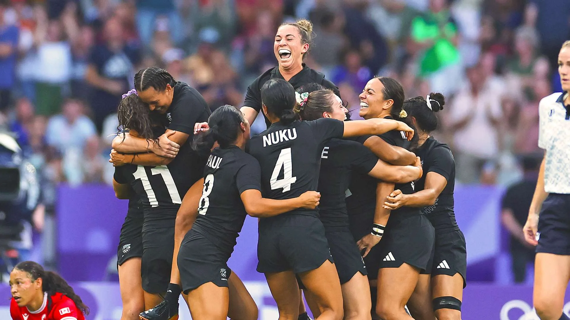 The Black Ferns celebrating on the field after they won the Olympic gold