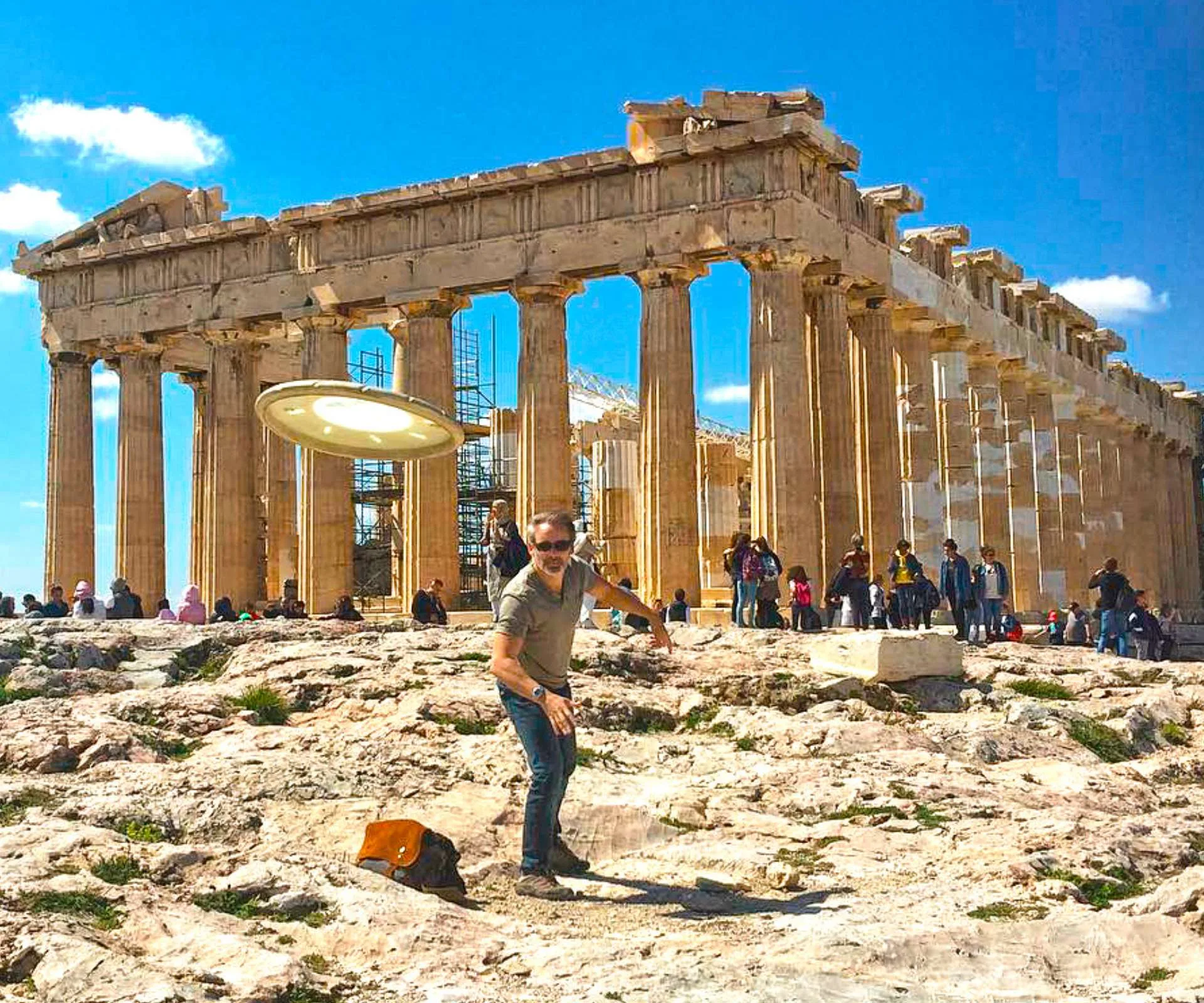 Paul Cleave throwing a frisbee in Athens