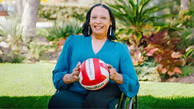 Maia Marshall-Amai in her wheelchair with a ball