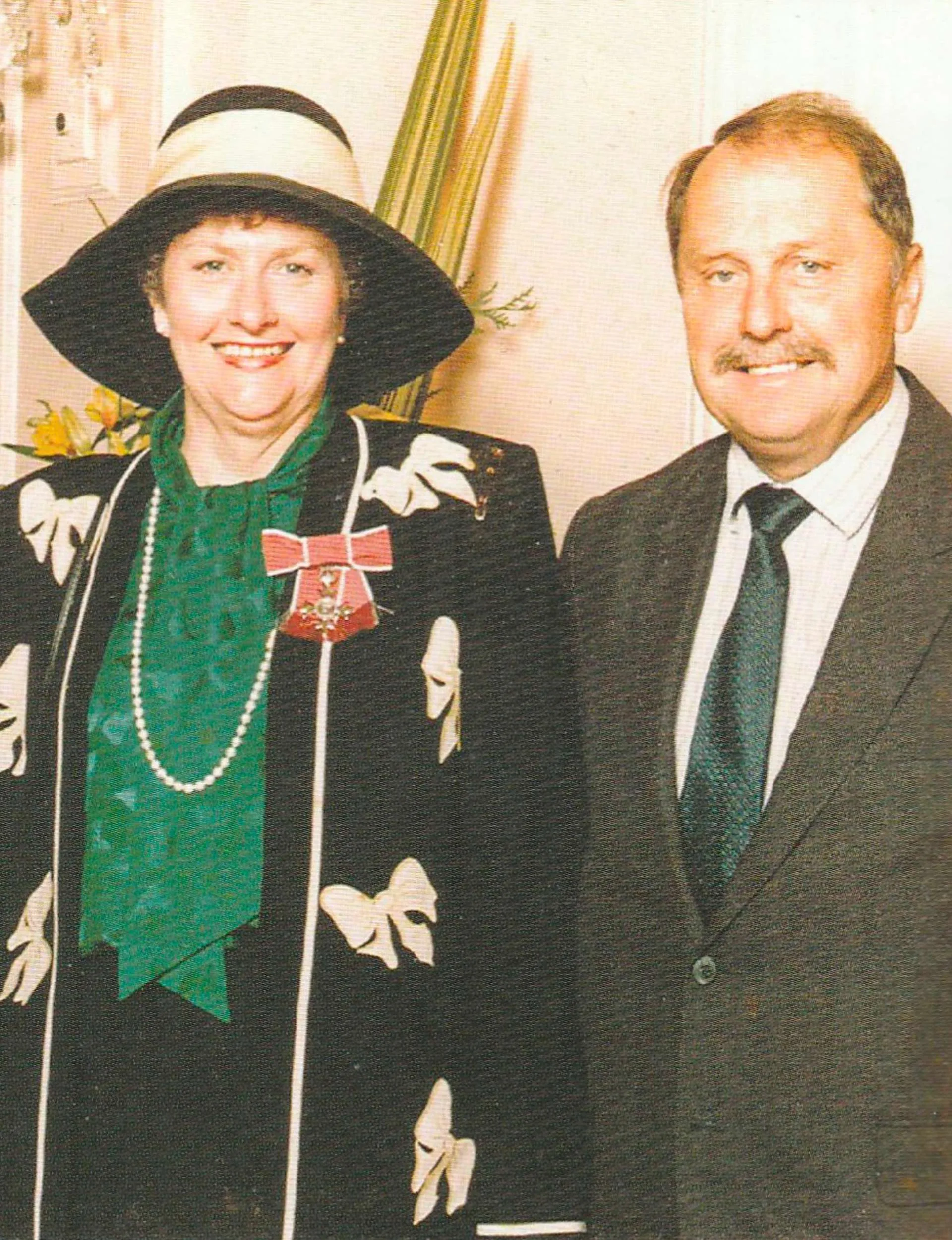 Dame Wendy Pye receiving her MBE with Don